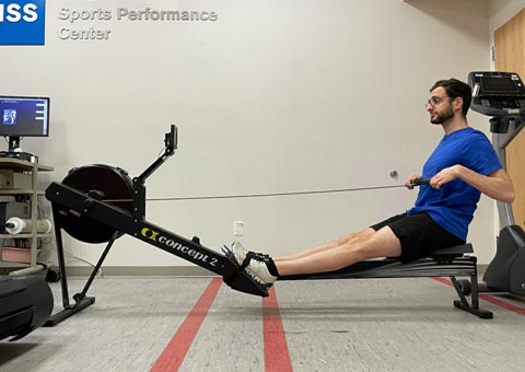 photo of aaron karp pulling handle to chest